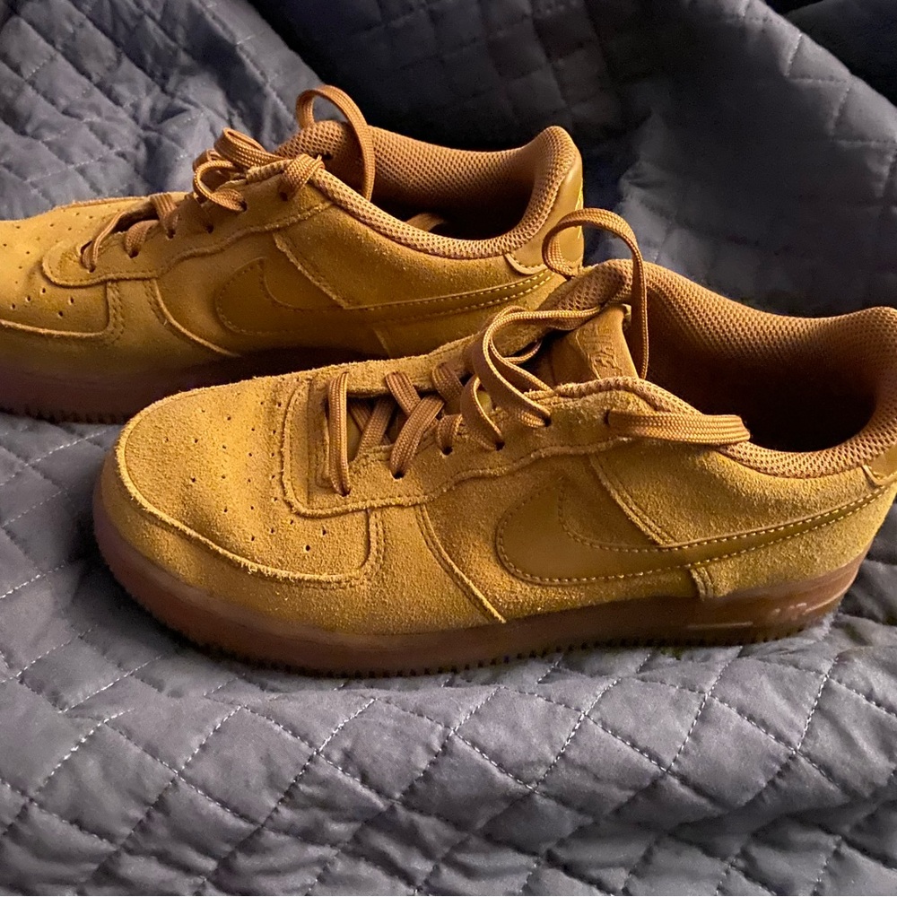 Tan colored with gum color bottom, Nike Air Force One shoes